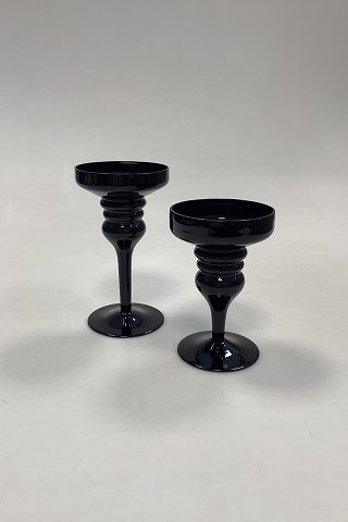 A pair of black glass Candlesticks